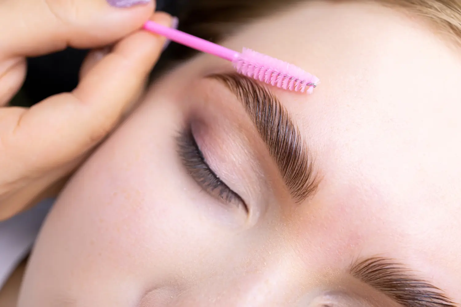 macro photography of the model's hairs the master combs the eyebrow hairs